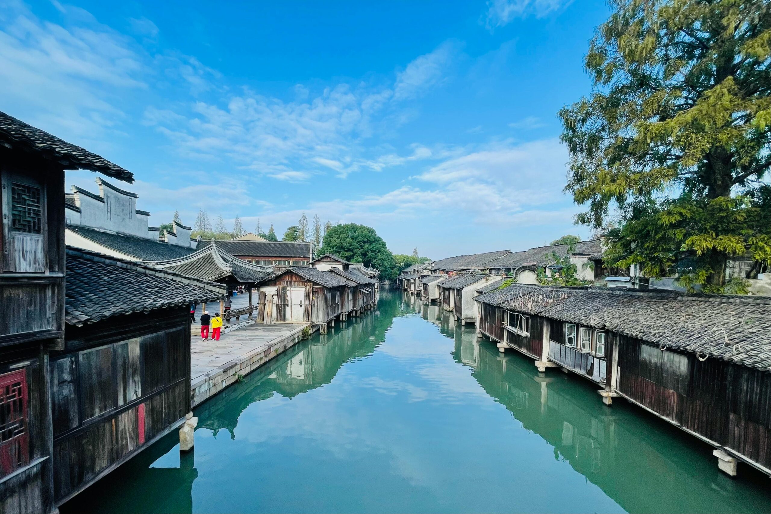 Stroll canals beneath lantern-lit bridges at Wuzhen East Scenic Area